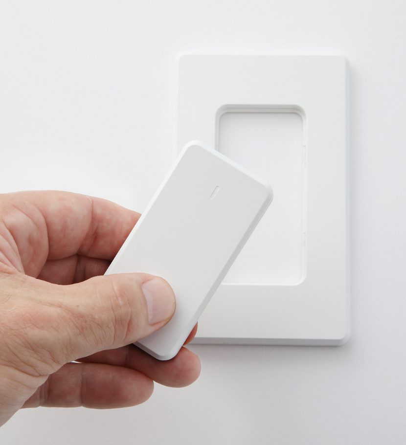 Photograph of a hand holding the remote control for the EPS Focus