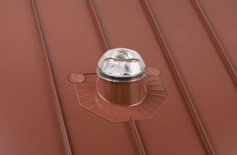 A solatube dome on a metal roof
