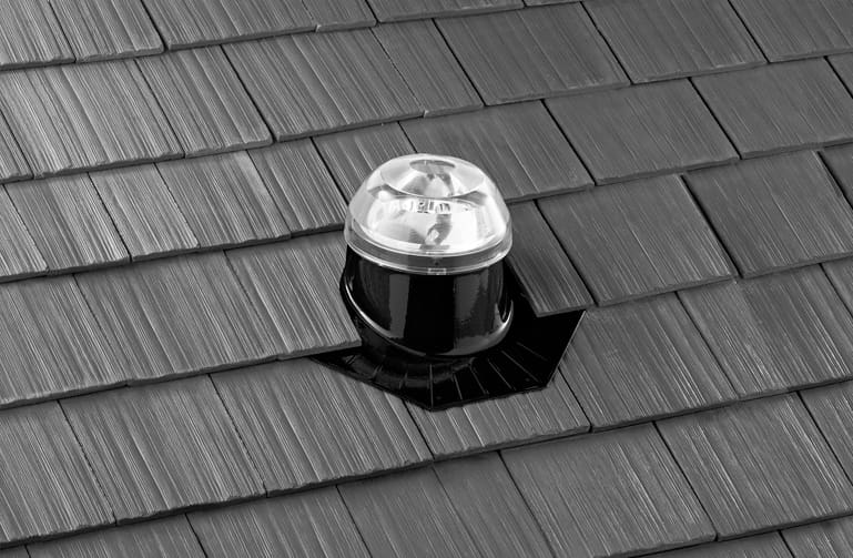 A solatube dome installed on a shake roof