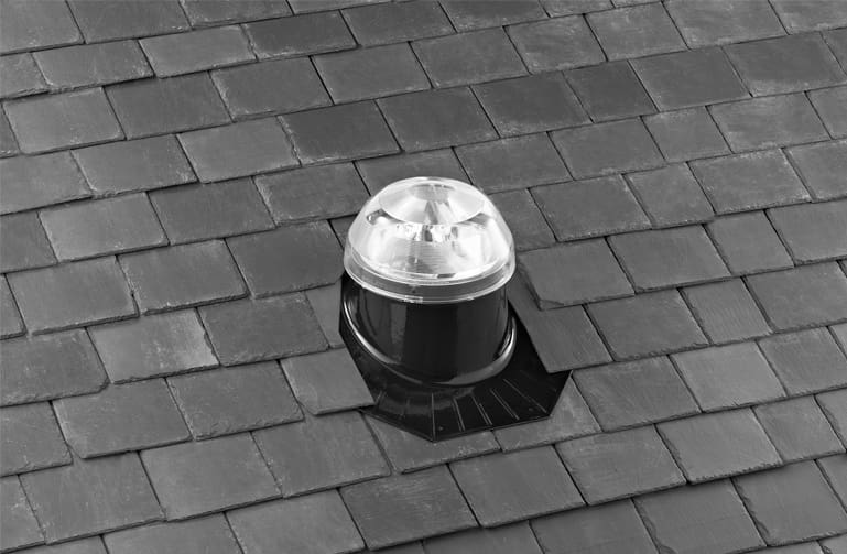 A solatube dome on a slate roof